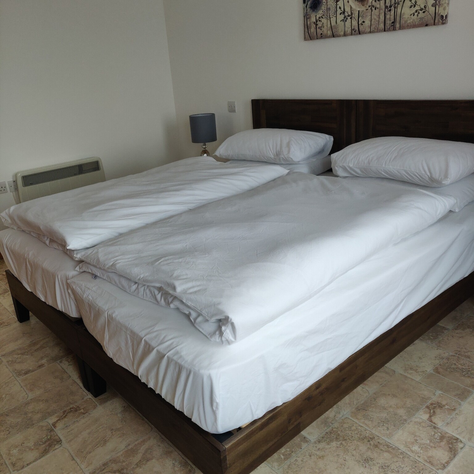 Bedroom with crisp white linen on a super king bed